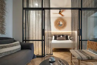 Cama o camas de una habitación en R26 Suites Sevilla