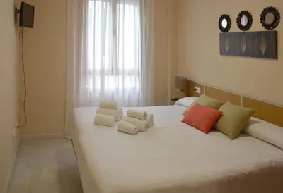 Cama o camas de una habitación en CASA PATIO LAS PALMERAs 7 y 8