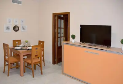 Una televisión o centro de entretenimiento en CASA PATIO LAS PALMERAs 7 y 8