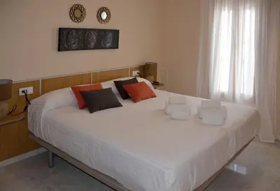 Cama o camas de una habitación en CASA PATIO LAS PALMERAs 7 y 8