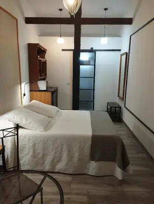 Cama o camas de una habitación en La REJA SUITE
