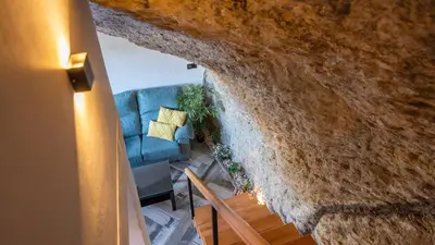 Zona de estar de Bajo la Alcazaba Setenil de las Bodegas by Ruralidays