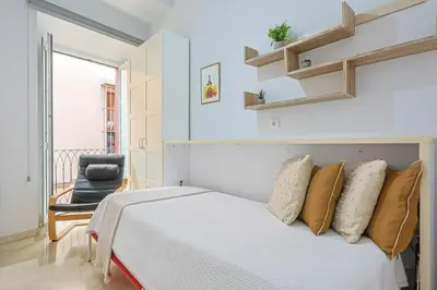 Cama o camas de una habitación en Lirios de Sevilla - Vacacional Sevilla