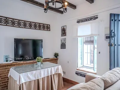 Una televisión o centro de entretenimiento en Apartment in Andalusia with Scenic Views