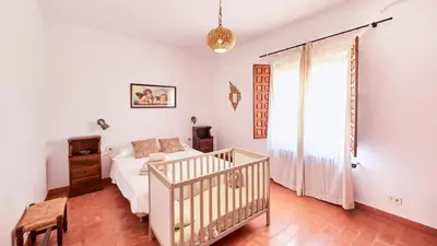 Cama o camas de una habitación en Casa Tía Any Espelúy by Ruralidays