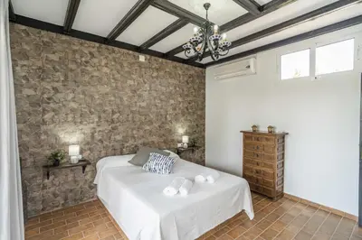 Cama o camas de una habitación en Casa Rural La Perla.