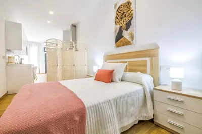 Cama o camas de una habitación en New Lofts Boutique Center Córdoba