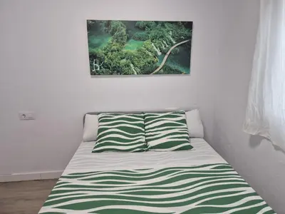 Cama o camas de una habitación en Casa Deluxe Gran Plaza