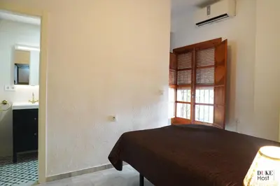 Cama o camas de una habitación en San Luis Apartment