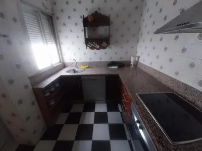 Una cocina o zona de cocina en Habitación F Aire Acondicionado y balcón