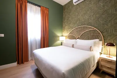 Cama o camas de una habitación en Suites Hotel Cetina Casa de Aguilar