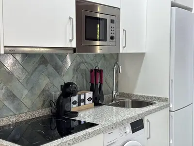 Una cocina o zona de cocina en Loft Avenida América