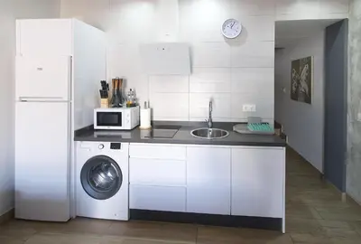 Una cocina o zona de cocina en Apartamentos Turisticos Ilusiones 2