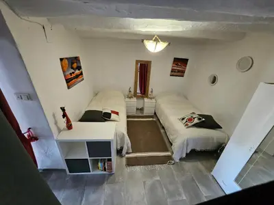 Cama o camas de una habitación en Le petit paradis de Nicole