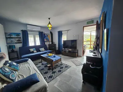 Zona de estar de Le petit paradis de Nicole