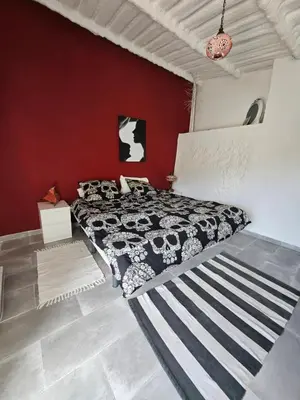 Cama o camas de una habitación en Le petit paradis de Nicole