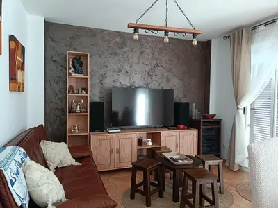Una televisión o centro de entretenimiento en Casita del Olivo