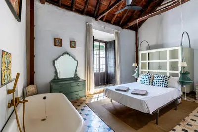 Cama o camas de una habitación en Casa de la Carrera Cantillana
