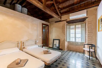 Cama o camas de una habitación en Casa de la Carrera Cantillana