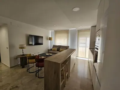 Una televisión o centro de entretenimiento en Apartamento Reyes Católicos