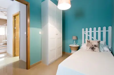 Cama o camas de una habitación en Apartamentos Alberto Lista 9