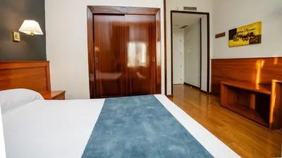 Cama o camas de una habitación en Hotel Zodiaco