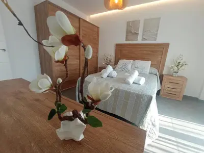 Cama o camas de una habitación en Alojamientos RAICES DEL SUR