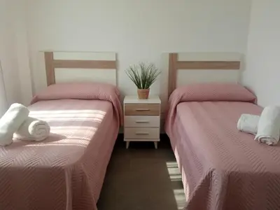 Cama o camas de una habitación en Alojamientos RAICES DEL SUR