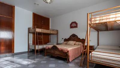 Cama o camas de una habitación en Los Tatos Alojamiento Rural