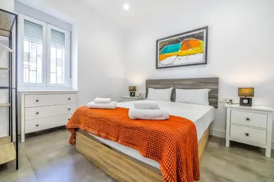 Cama o camas de una habitación en KOKO Apartment junto al casco histórico