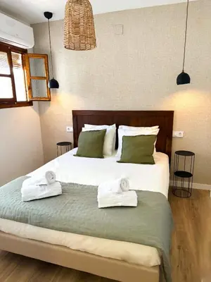 Cama o camas de una habitación en Apartamentos Puerta de Sefarad