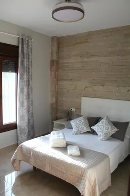 Cama o camas de una habitación en Casa Rural de Piedra