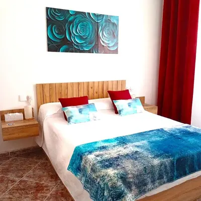 Cama o camas de una habitación en Habitación en Casa Dulce Romero