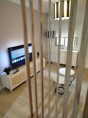 Una televisión o centro de entretenimiento en Precioso apartamento totalmente reformado