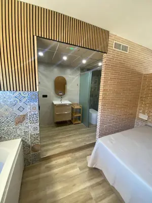 Cama o camas de una habitación en Apartamento en Sevilla DELUXURYROOM