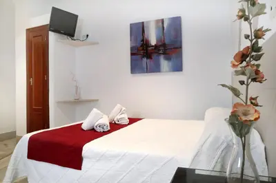 Cama o camas de una habitación en HOSTAL ViCTORiA