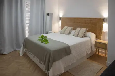 Cama o camas de una habitación en La Casa del Gallo Alojamientos by Taberna Bolero
