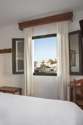 Cama o camas de una habitación en Hotel Tugasa Sierra y Cal