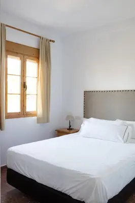 Cama o camas de una habitación en Hotel Tugasa El Almendral