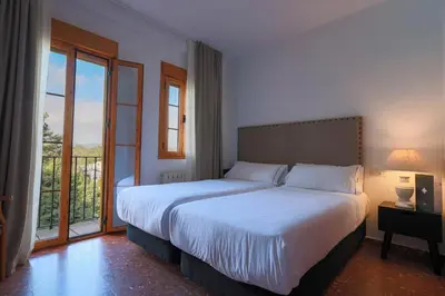 Cama o camas de una habitación en Hotel Tugasa El Almendral