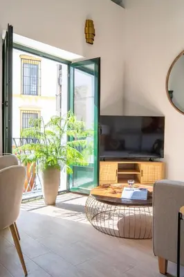 Una televisión o centro de entretenimiento en Casa del Gitano by Época Suites