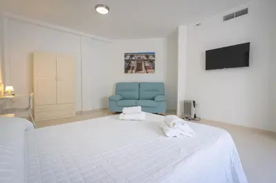 Cama o camas de una habitación en Hostal Las Viñas