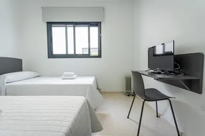 Cama o camas de una habitación en Hostal Las Viñas