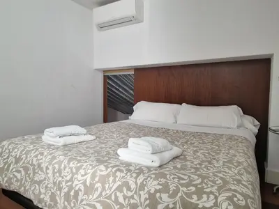 Cama o camas de una habitación en Elegant duplex in the heart of Seville