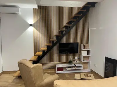 Una televisión o centro de entretenimiento en Apartamento Deluxe Cantillana