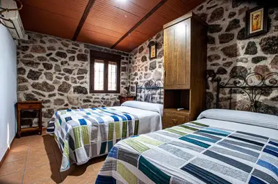 Cama o camas de una habitación en Alojamiento Rural Los Abuelos del Navaltorno