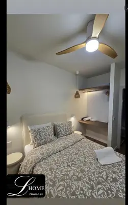 Cama o camas de una habitación en LHOME Puerta Osario Centro Ciudad