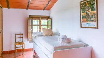 Cama o camas de una habitación en La Zaranda de Pinillos Antequera by Ruralidays