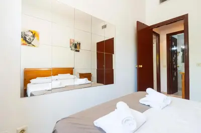 Cama o camas de una habitación en Palacio de Congresos piscina y parking