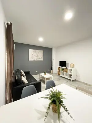 Una televisión o centro de entretenimiento en Macarena Apartment